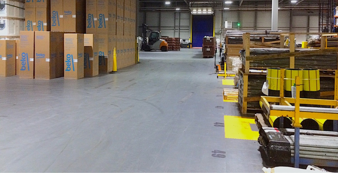SSE warehouse with zones marked out using yellow Ecotile floor tiles