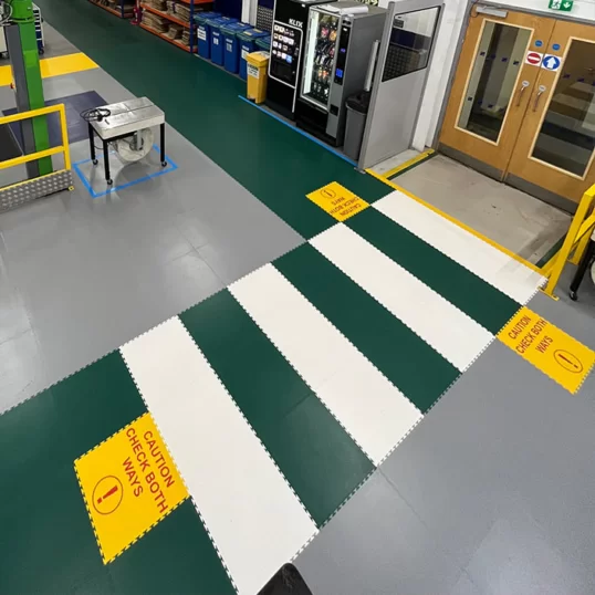Walkway with zebra crossing showing some floor marking for safety standards