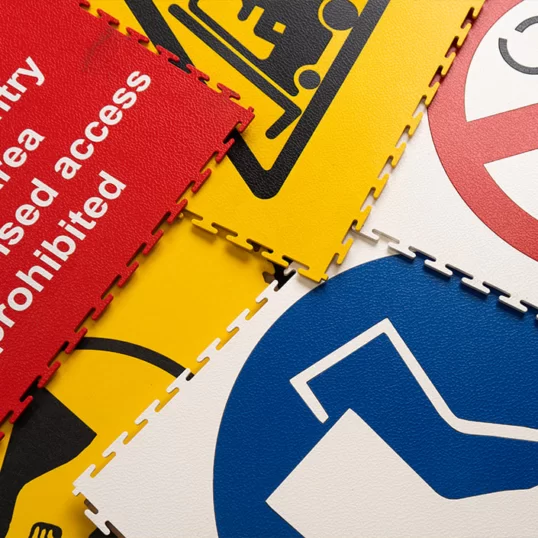 Collection of different floor signage safety sizes in different types on Ecotile floor tiles