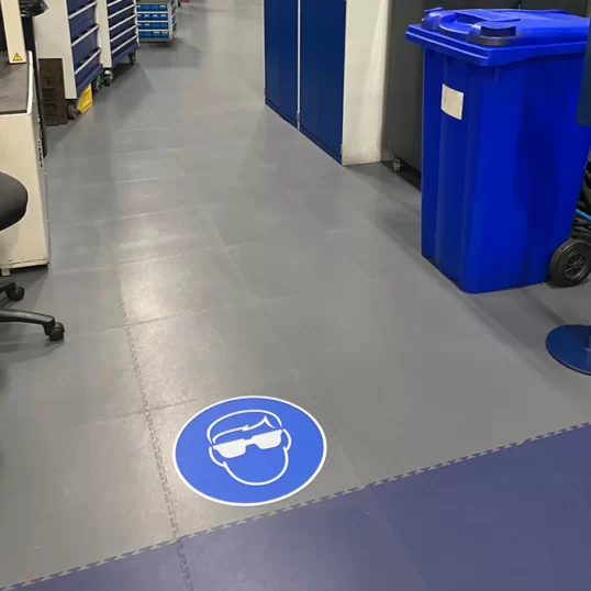 Printed safety signage with eye wear protection for warehouses