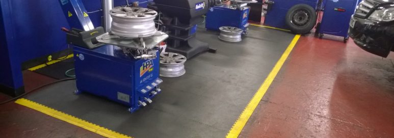An Ecotile installed floor at Kwik Fit Cricklewood