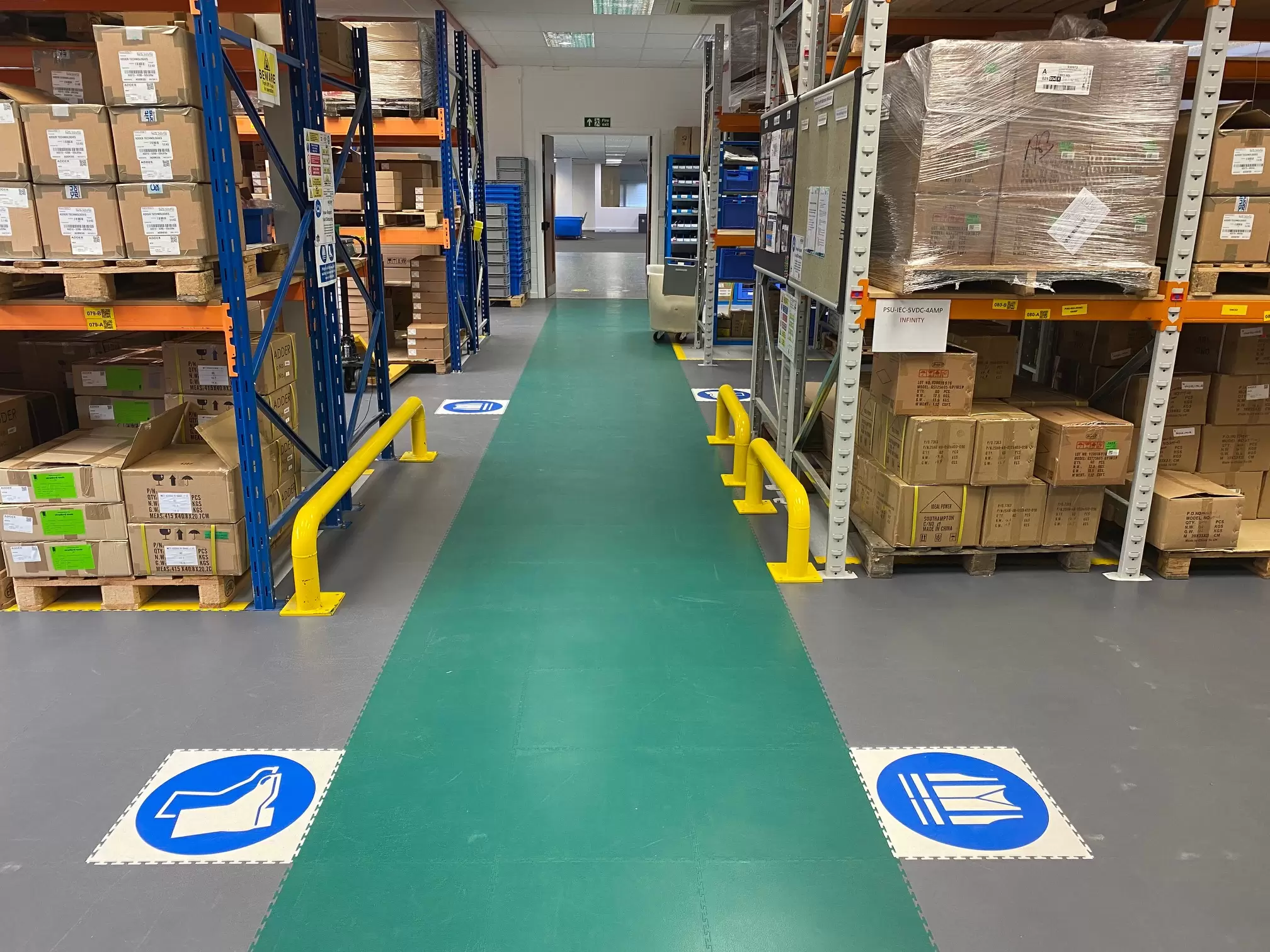 Combining green ecotiles and safety messages to create a safe walkway in a warehouse