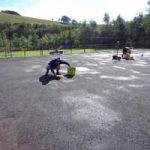Patch Reparing An Old Tennis Court