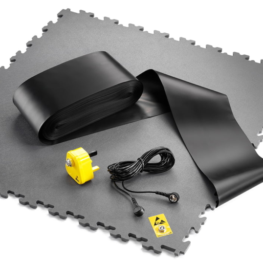 Photo of Ecotile's ESD flooring tile and an ESD installation kit with conductive grounding tape and bonding plug