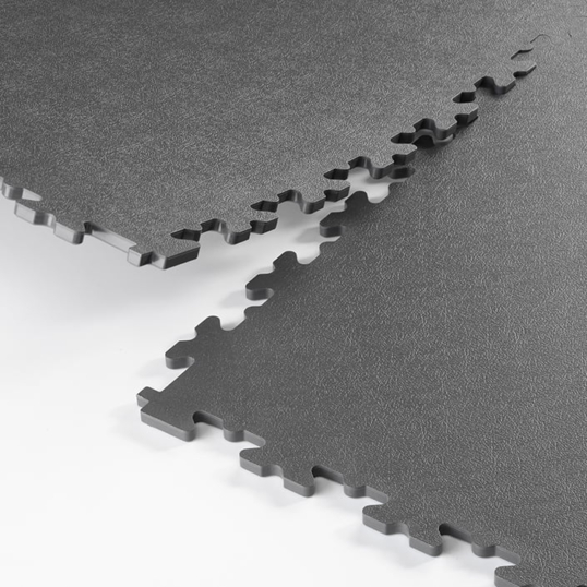 Close up showing Ecotile's ESD interlocking tiles connecting together and showing the interlocking joints