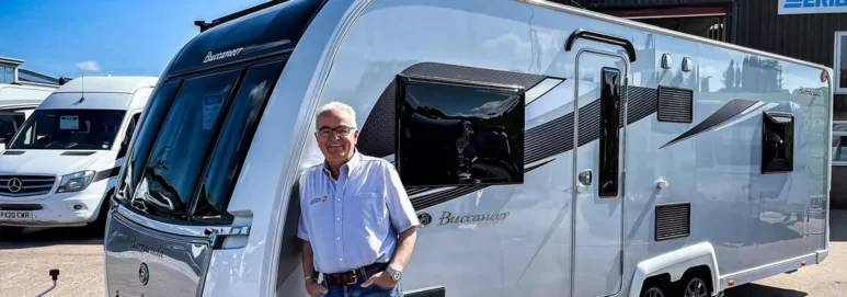Owner of advanced leisure vehicle standing outside his building with Ecotile on floor