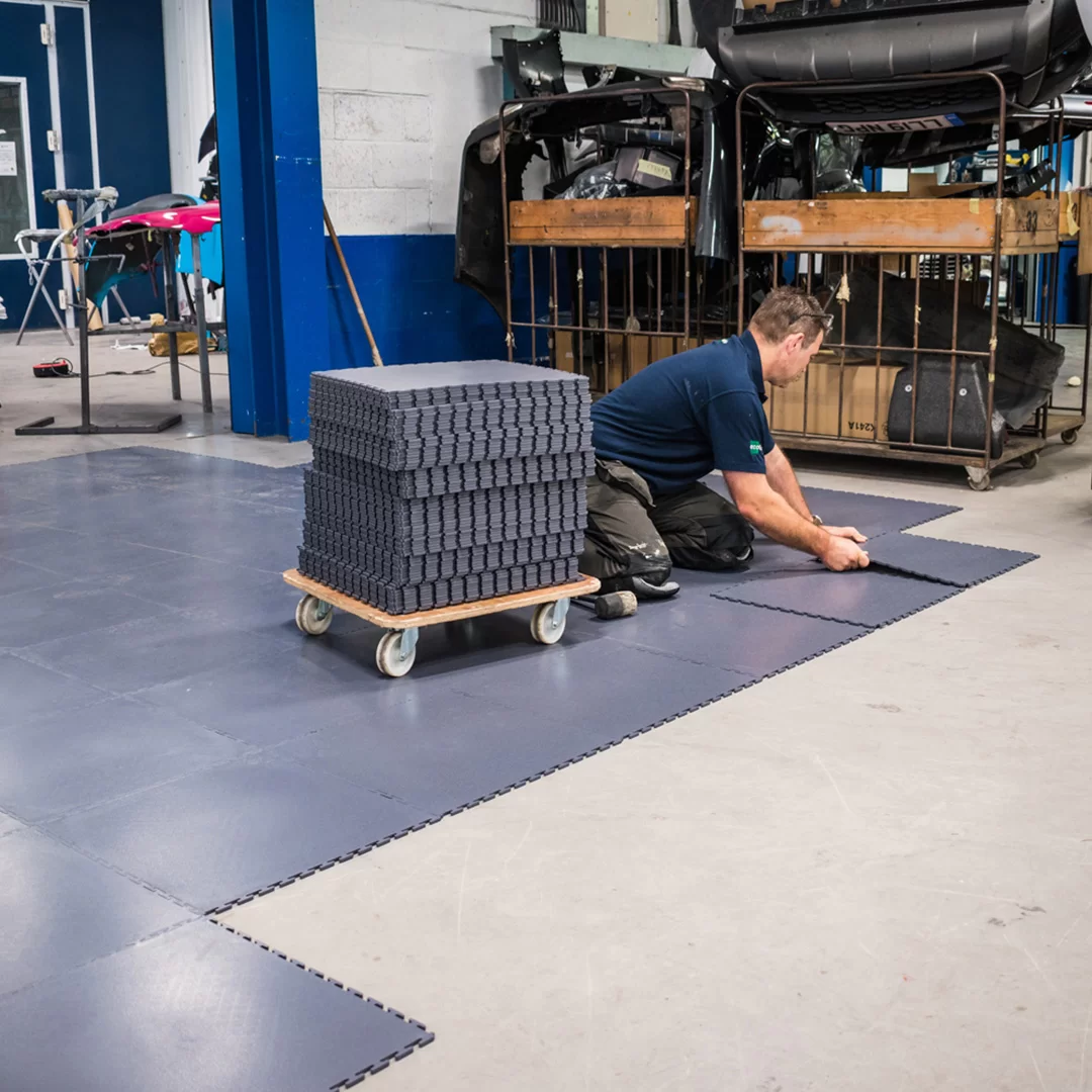 Laying Ecotile's industrial flooring