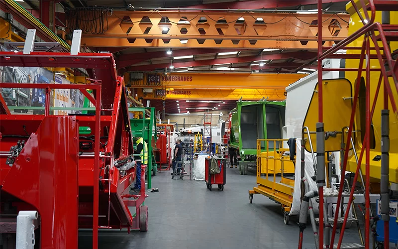 Refuse vehicle hoppers being constructed on Ecotile