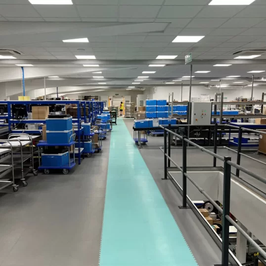 A custom brand colour embedded into an ecotile floor walkway