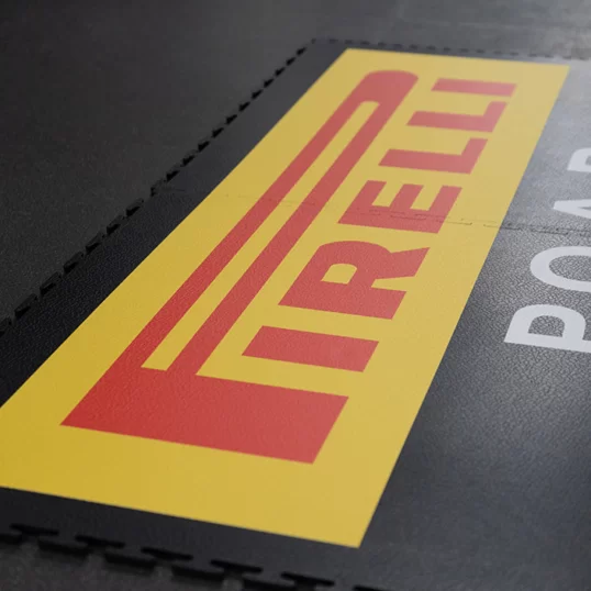 Pirelli logo, custom floor graphics and logo spread across two Ecotiles