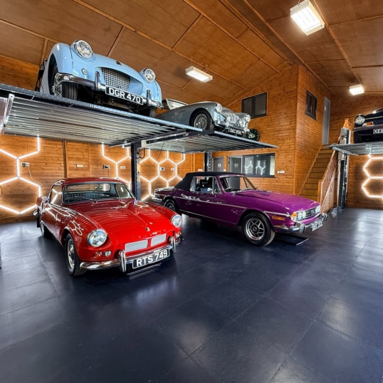 Beautiful car showroom with classic cars on it, on an Ecotile floor