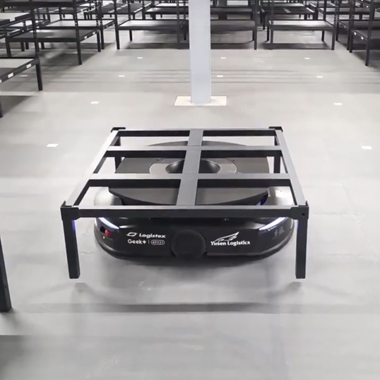 Image of a Geek+ robot shelf system and Ecotile floor with markers